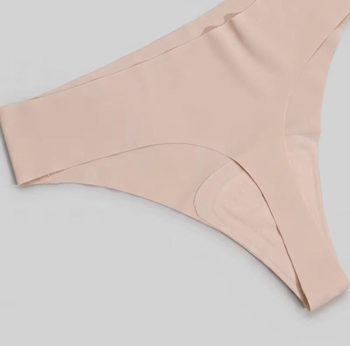 Close-up of the pale pink seamless thong showing its front panel and smooth edges