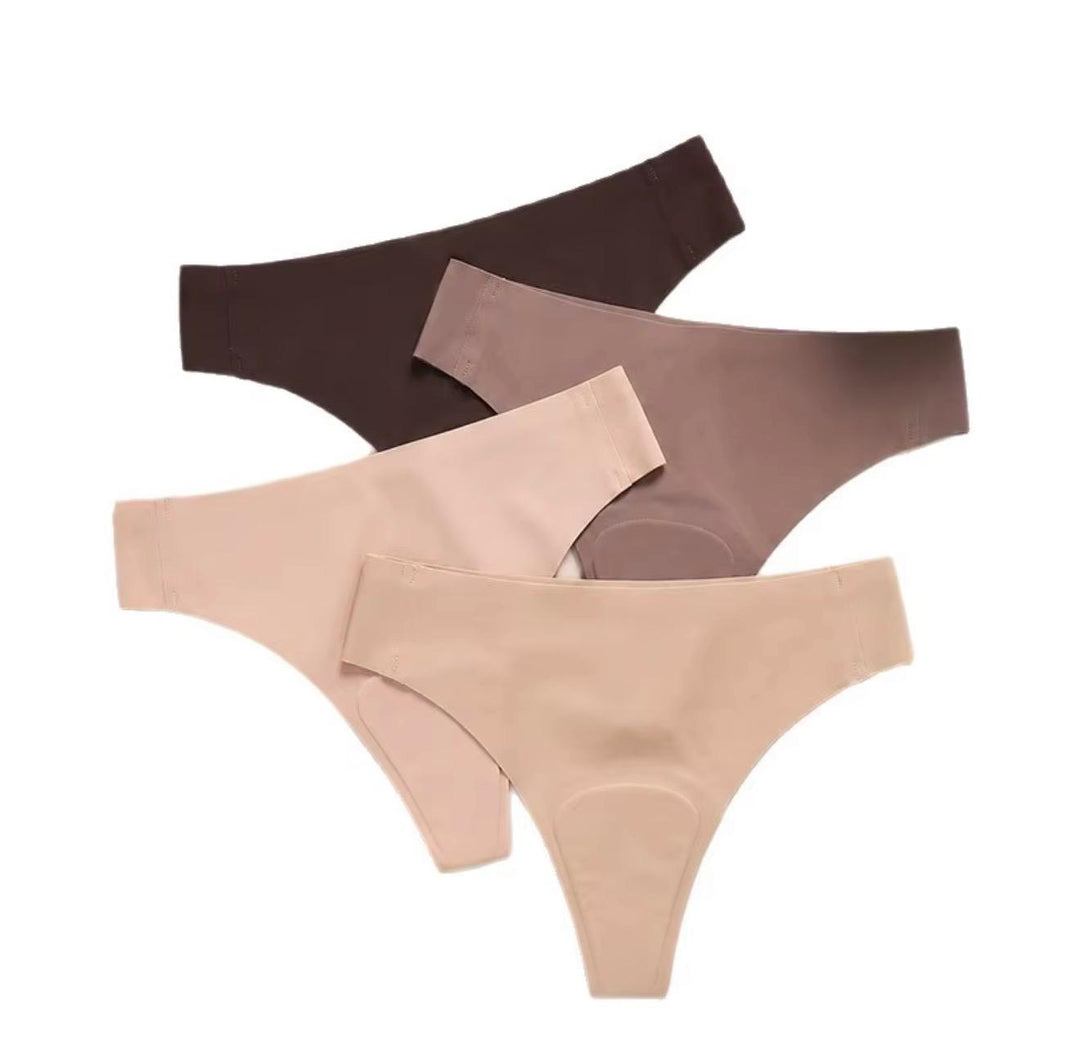 Four seamless thongs in pale pink, beige, taupe and dark brown arranged diagonally